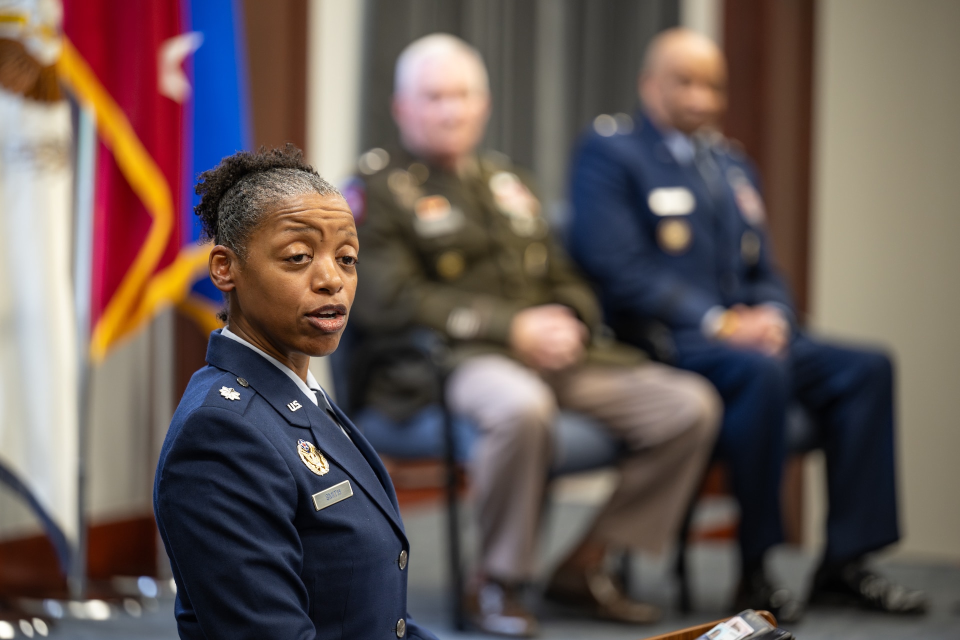 U.S. Air Force Lt. Col. Jenohn LeShea Smith, Air Reserve Component Training Division chief at the Air Force Judge Advocate General’s School, speaks to the audience at a retirement ceremony for U.S. Air Force Maj. Gen. Charles Walker, Air National Guard assistant to the judge advocate general of the United States Air Force, in Nashville, Tenn., July 24, 2026. Walker is concluding a distinguished 35-year career during which he previously served as director of the Office of Complex Investigations at the National Guard Bureau in Washington, D.C., chief of staff for the Air Component at Joint Force Headquarters—Kentucky National Guard, and staff judge advocate for the Kentucky Air Guard’s 123rd Airlift Wing in Louisville. (U.S. Air National Guard photo by Dale Greer)