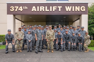 U.S. and Japanese Airmen pose for a group photo.