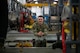 A military member leans against equipment