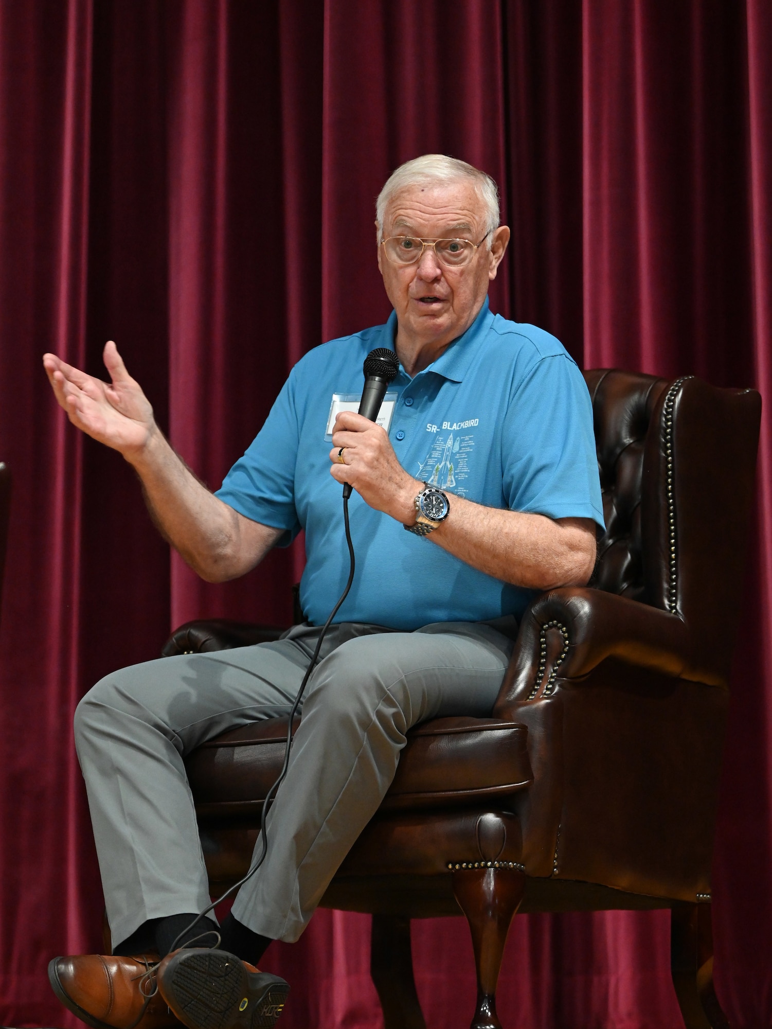 U.S. Air Force Lt. Col. (ret.) Gerald Glasser, former SR-71 Blackbird pilot, shares some of his memories of flying the supersonic aircraft with the audience at RAF Mildenhall, England, July 27, 2026. Glasser and other SR-71 veteran pilots, aircrew and maintainers, along with their family members, received mission briefings and a tour of the base, including hangars where they once worked, and static displays. (U.S. Air Force photo by Karen Abeyasekere)
