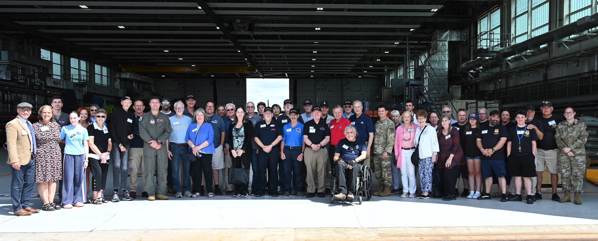 U.S. Air Force SR-71 Blackbird veterans, their families, and Team Mildenhall Airmen and civilians, pose for a photo on RAF Mildenhall, England, July 27, 2026. The SR-71 was assigned to RAF Mildenhall as part of Detachment 4, 9th Reconnaissance Wing from 1976 to 1990.  The SR-71 veterans were all stationed here during that timeframe and were grateful for the opportunity to revisit. (U.S. Air Force photo by Karen Abeyasekere)