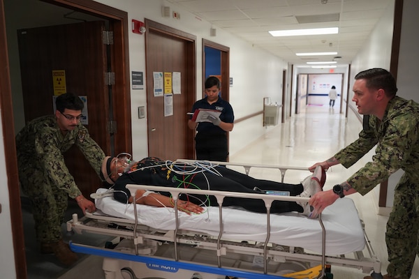 U.S. Navy hospital corpsmen prepare a simulated casualty for magnetic resonance imaging during a mass casualty exercise at U.S. Naval Hospital Rota, Spain, June 25, 2026. The training tested the hospital’s ability to coordinate diagnostic care and manage multiple patients during a large-scale emergency. (U.S. Navy photo by Hospital Corpsman 2nd Class Ahmi Atsina)