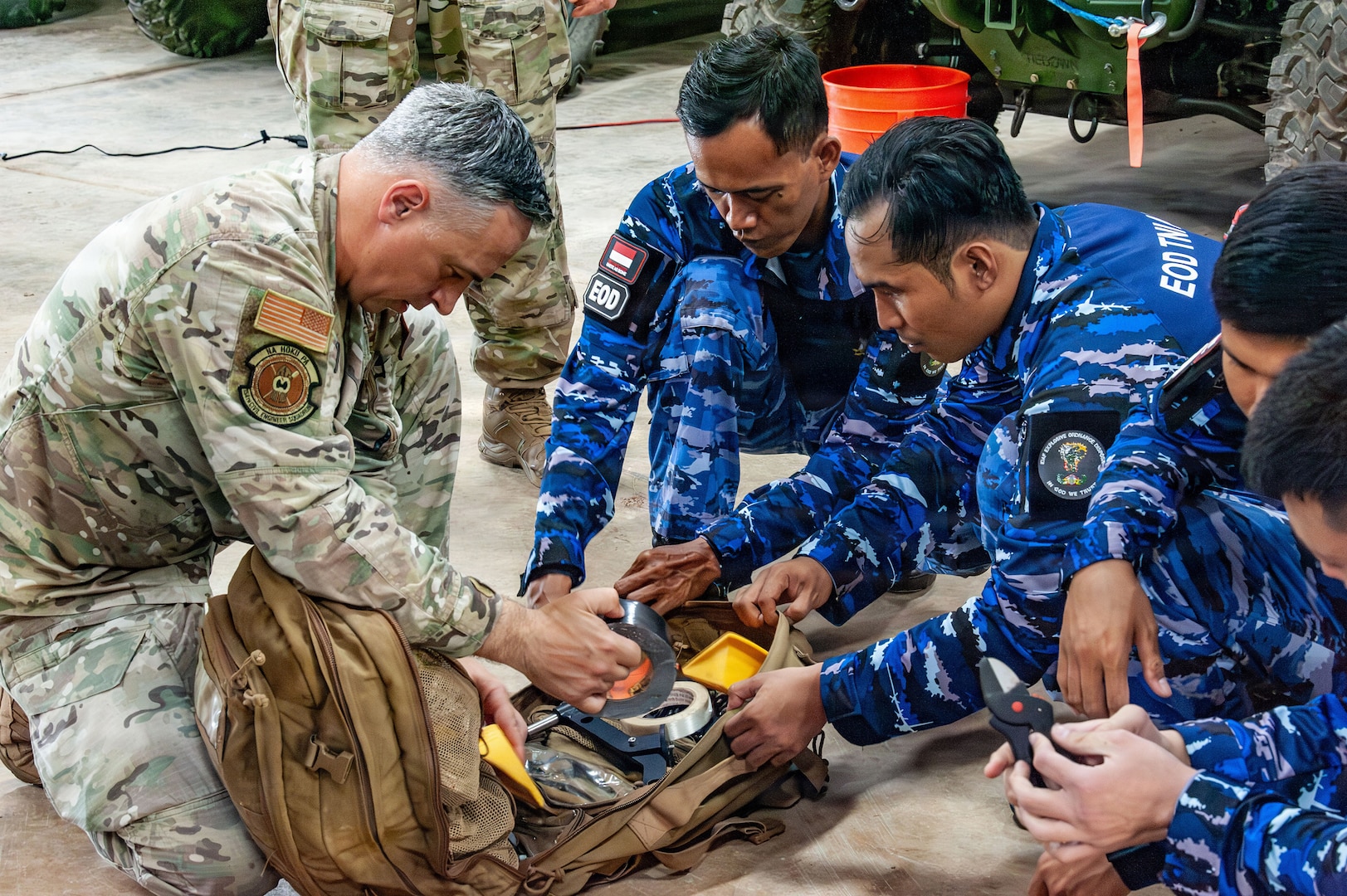 U.S. Air Force Master Sgt. Dustin Frey, 154th Explosive Ordnance Disposal, or EOD, flight technician, presents and reviews hook and line equipment to the Indonesian Air Force EOD on Andersen Air Force Base, Guam, July 21, 2026.