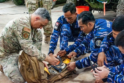 U.S. Air Force Master Sgt. Dustin Frey, 154th Explosive Ordnance Disposal, or EOD, flight technician, presents and reviews hook and line equipment to the Indonesian Air Force EOD on Andersen Air Force Base, Guam, July 21, 2026.