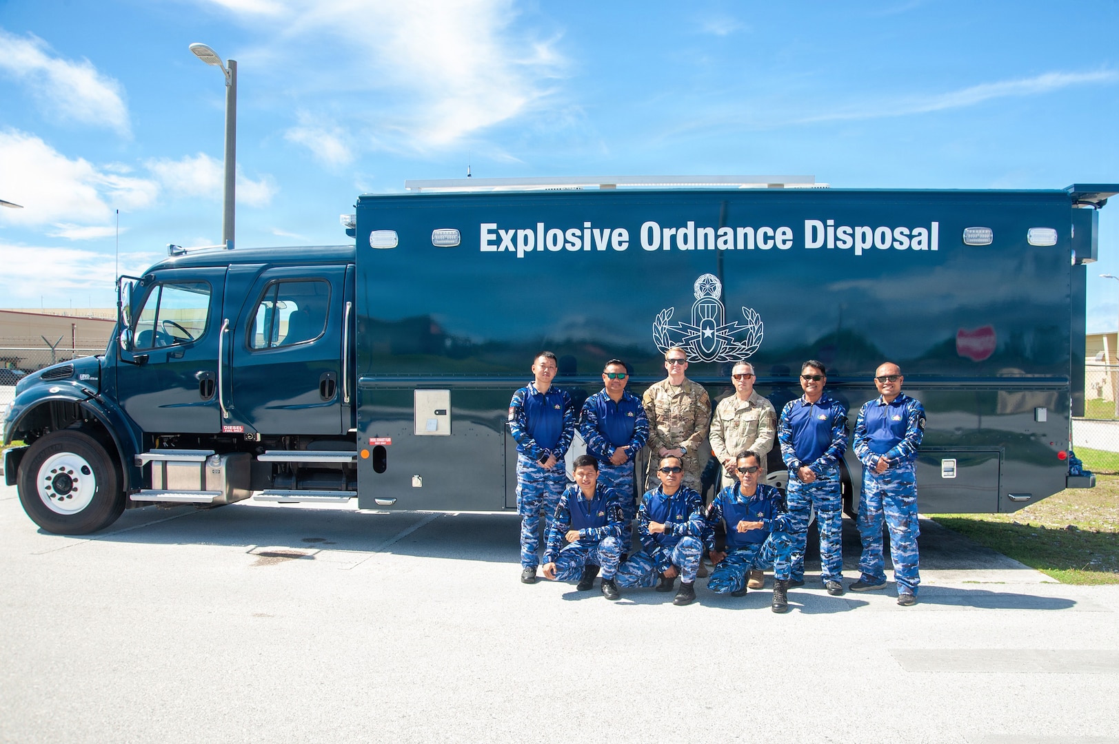 U.S. Air Force and Indonesian Air Force emergency ordnance disposal technicians gather in front of Bomb Squad Emergency Response Vehicle, or BSERV, as part of the Department of War National Guard Bureau State Partnership Program’s subject matter expert exchange held on Andersen Air Force Base, July 24, 2026.
