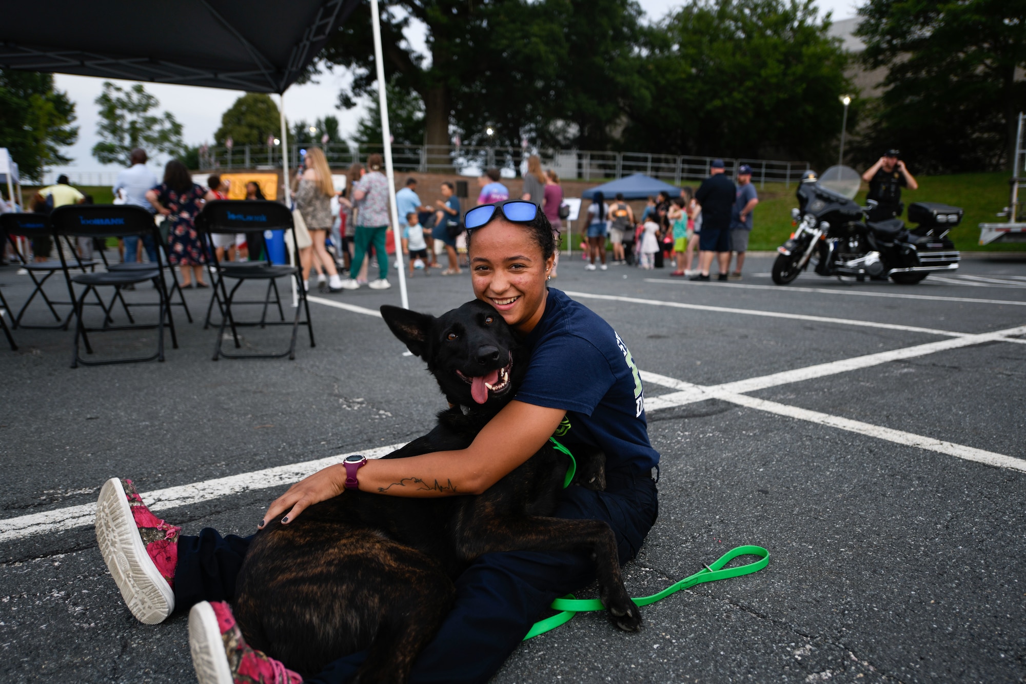 Raina Jenkins, an Arbutus Volunteer Fire Department member, poses with her dog