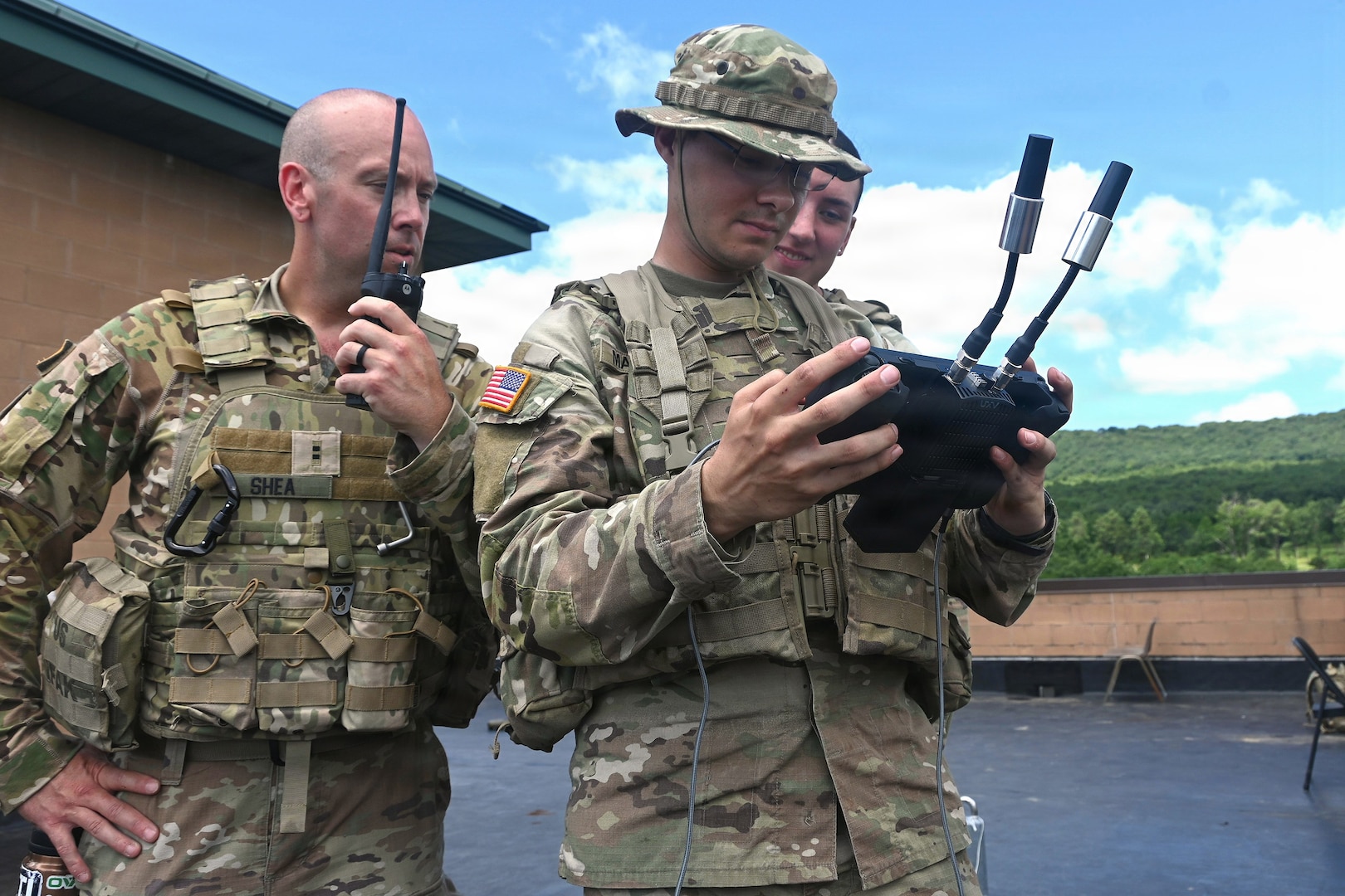 Pennsylvania National Guard Soldiers from M Company, 56th Mobile Brigade Combat Team control an unmanned aircraft system during a multi-domain exercise conducted by the 556th Military Intelligence Company, Aug. 3, 2026 at Fort Indiantown Gap, Pennsylvania.
