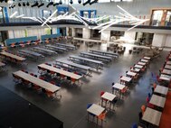 A room with tables and chairs.