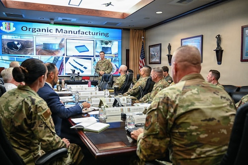 Airman briefs CMSgt Wolfe and Base Leadership