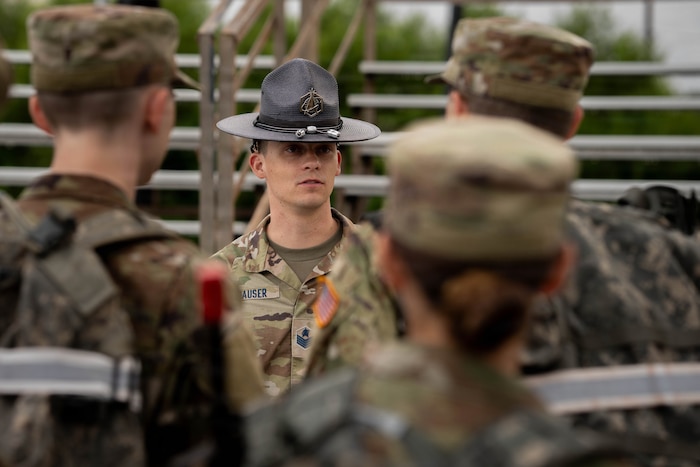 MTI in uniform outside with cadets in background
