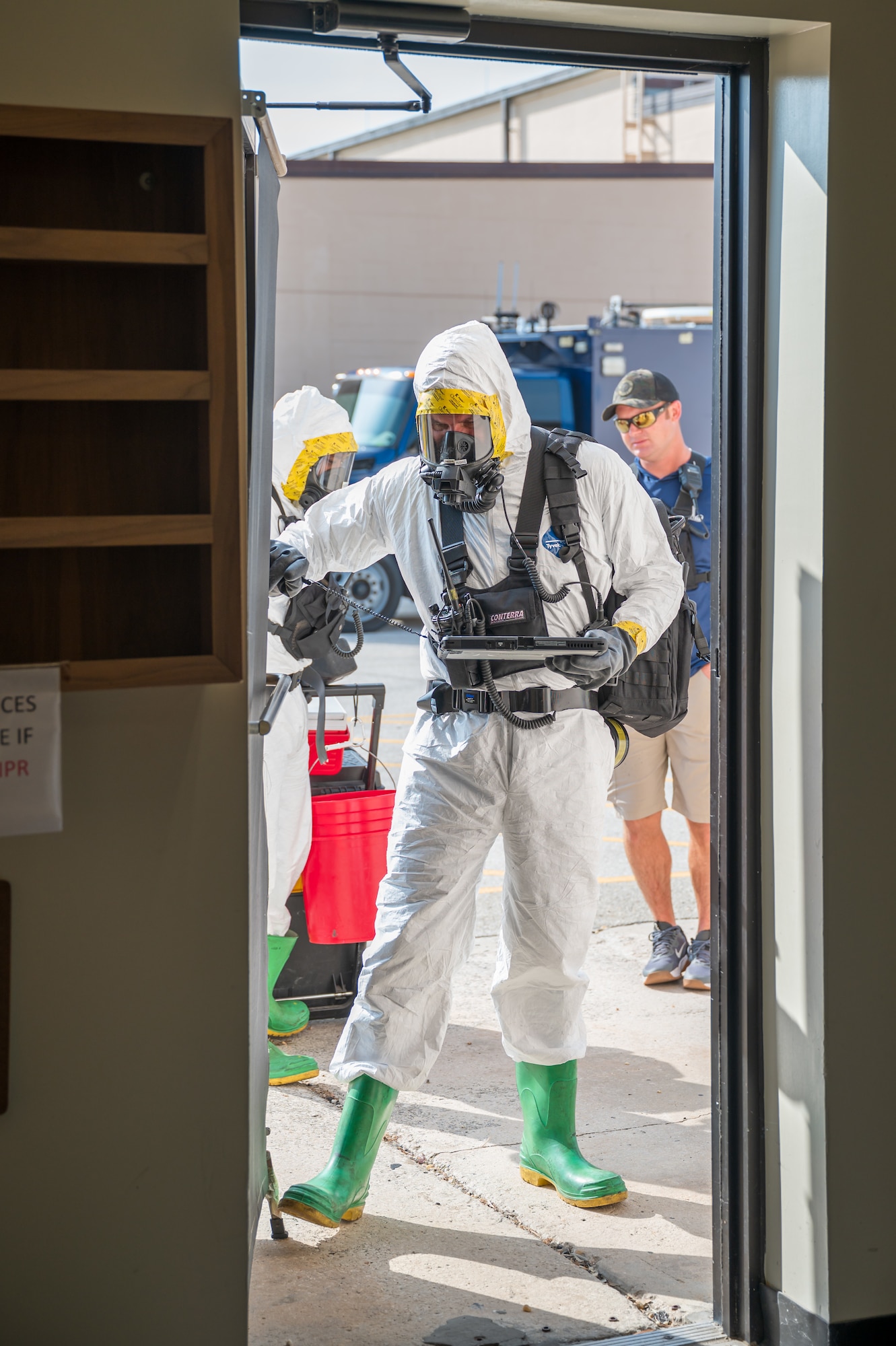 Space Launch Delta 45 Emergency Management personnel and members of the Florida National Guard’s 44th Weapons of Mass Destruction Civil Support Team conduct a joint hazardous materials response training exercise at Patrick Space Force Base, Fla., July 28, 2026. A survey team member carries detection and communications equipment into a simulated contaminated area to identify potential hazards and relay findings to incident command. (U.S. Space Force photo by Gwendolyn Kurzen)