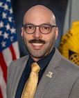 Edwin Vega, U.S. Army Financial Management Command Operations plans specialist, poses for a photo at the Maj. Gen. Emmett J. Bean Federal Center in Indianapolis Feb. 12, 2026. USAFMCOM delivers precision enterprise-wide financial operations to integrate, synchronize and sustain the battlefield through the Joint Strategic Support Area and directly supports the Office of the Assistant Secretary of the Army for Financial Management and Comptroller in their role as the principal advisor on all matters related to financial management and comptrollership. (U.S. Army photo by Mark R. W. Orders-Woempner)