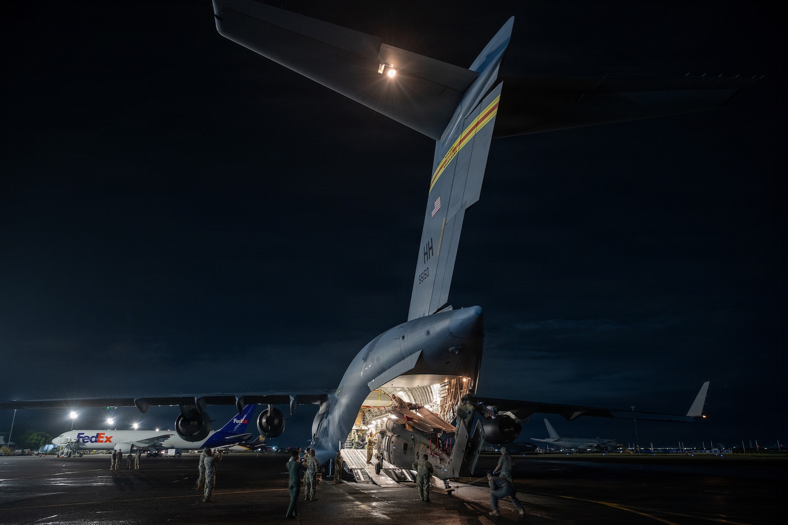 Hawaii Army National Guard Soldiers and Hawaii Air National Guard Airmen begin unloading a Hawaii Army National Guard UH-60M Black Hawk helicopter from a Hawaii Air National Guard C-17 Globemaster III assigned to the 204th Airlift Squadron after arriving at Clark Air Base, Philippines, Aug. 1, 2026.
