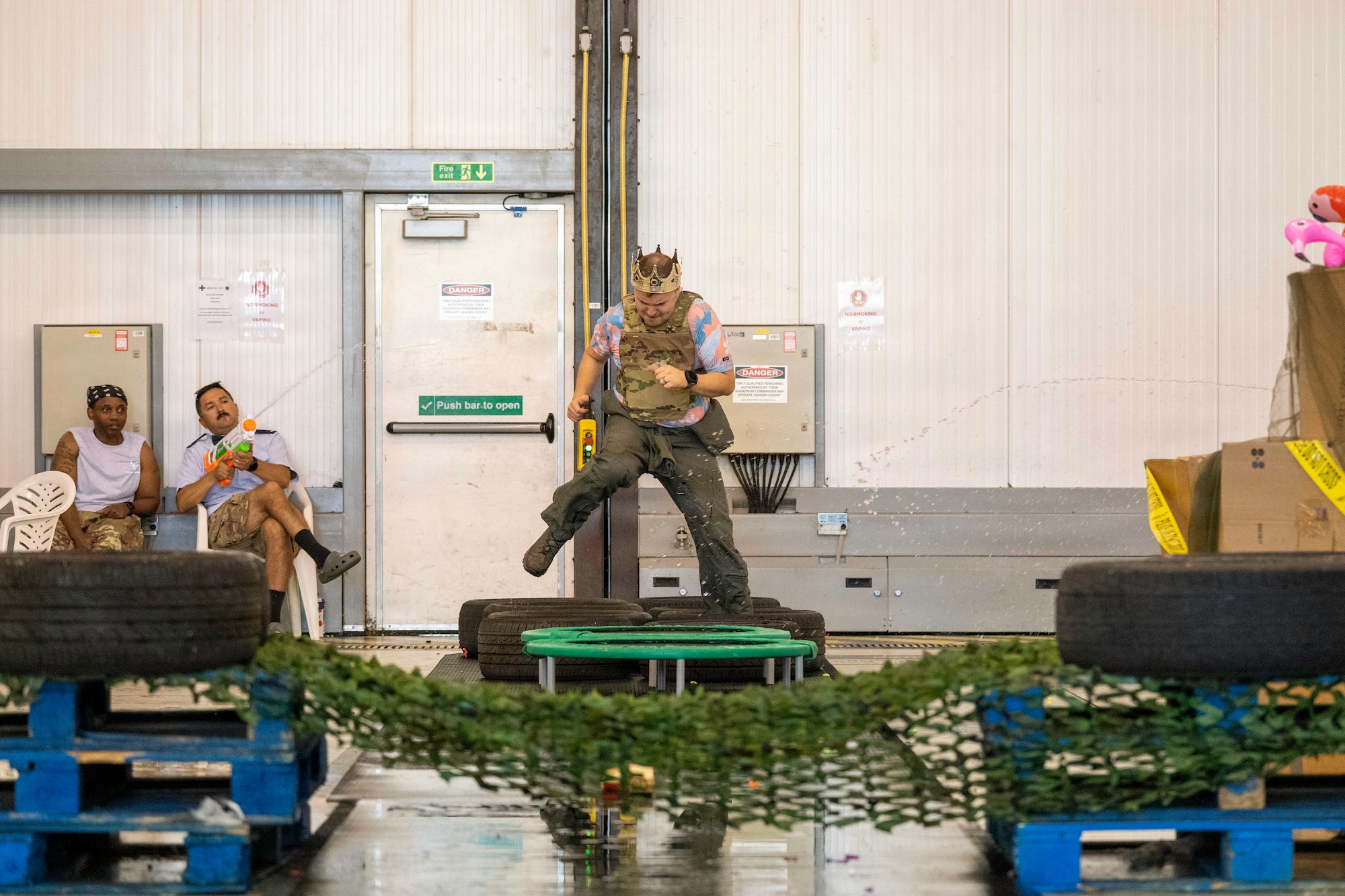 A participant traverses an obstacle course during a combat dining-in challenge