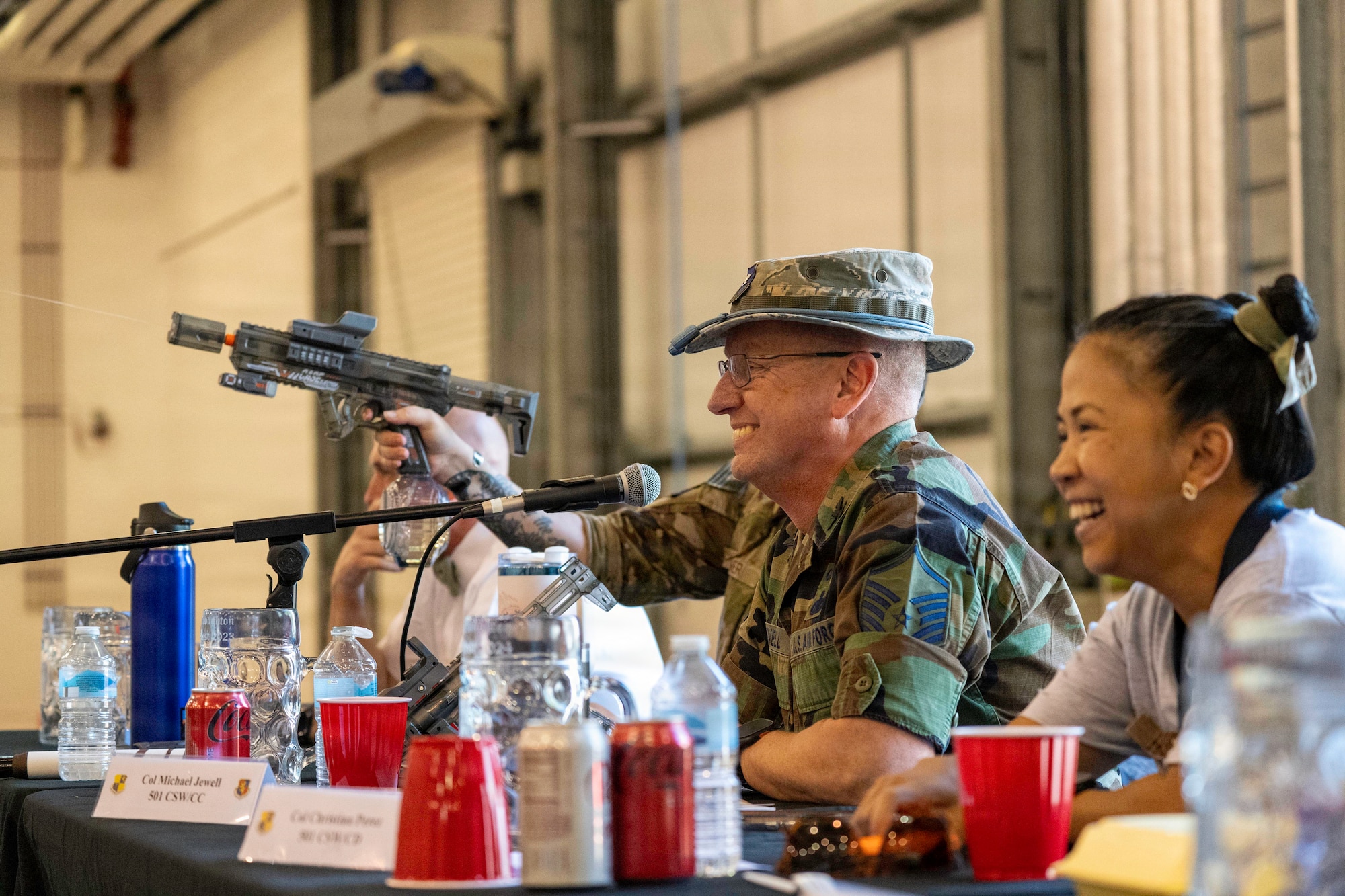 Attendees smile during a combat dining-in