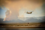 A Nevada Army Guard CH-47 Chinook departs for the Ward Fire near Ely, Nevada, on Saturday. After several days of intense aerial suppression efforts, the Nevada Army National Guard and fire officials with the U.S. Forest Service report that the Ward Fire has jumped to 27 percent containment, positive news for the blaze just south of Ely.