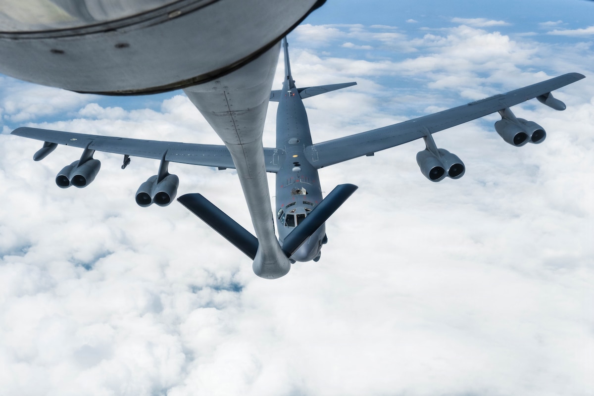 A B-52 Stratofortress assigned to the 5th Bomb Wing approaches a KC-135 Stratotanker assigned to the 22nd Air Refueling Wing