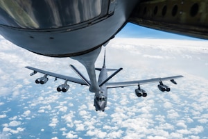 A B-52 Stratofortress assigned to the 5th Bomb Wing flies steadily behind a KC-135 Stratotanker assigned to the 22nd Air Refueling wing