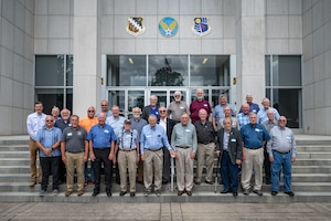 Arnold Engineering Development Complex Fellows gather for a photo on the steps of the Administration and Engineering Building at Arnold Air Force Base, Tenn., during AEDC Fellows Day, Aug. 5, 2026. AEDC is headquartered at Arnold AFB. The AEDC Fellows program, established in 1989 and managed by the Arnold Community Council, recognizes AEDC personnel who have made substantial and exceptionally distinguished contributions to the nation’s aerospace ground testing capability. This year, Ryan Bond, Ph.D.; Chester Furlong; Sam Dougherty; Randy Nicholson and Johannes van Aken, Ph.D., were induced as AEDC Fellows. The newly selected Fellows were recognized during the AEDC 75th anniversary open house event held June 27 at Arnold AFB. (U.S. Air Force photo by Keith Thornburgh)