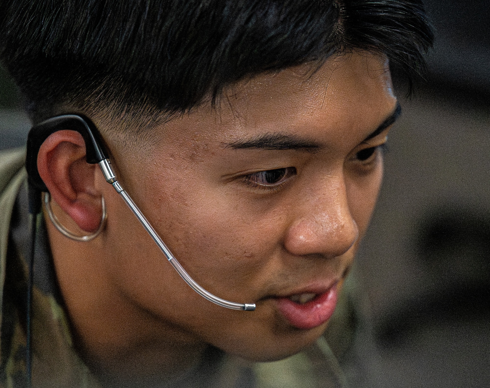 U.S. Air Force Senior Airman Reazon Cleofas, 97th Operations Support Squadron air traffic control radar approach control trainer, guides the 97th Air Mobility Wing command team through the Standard Terminal Automation Replacement System simulator at Altus Air Force Base, Oklahoma, Aug. 4, 2026. The hands-on immersion tour allowed the command team to see how radar approach controllers monitor aircraft and communicate with pilots. (U.S. Air Force photo by Airman 1st Class Emma Wright)