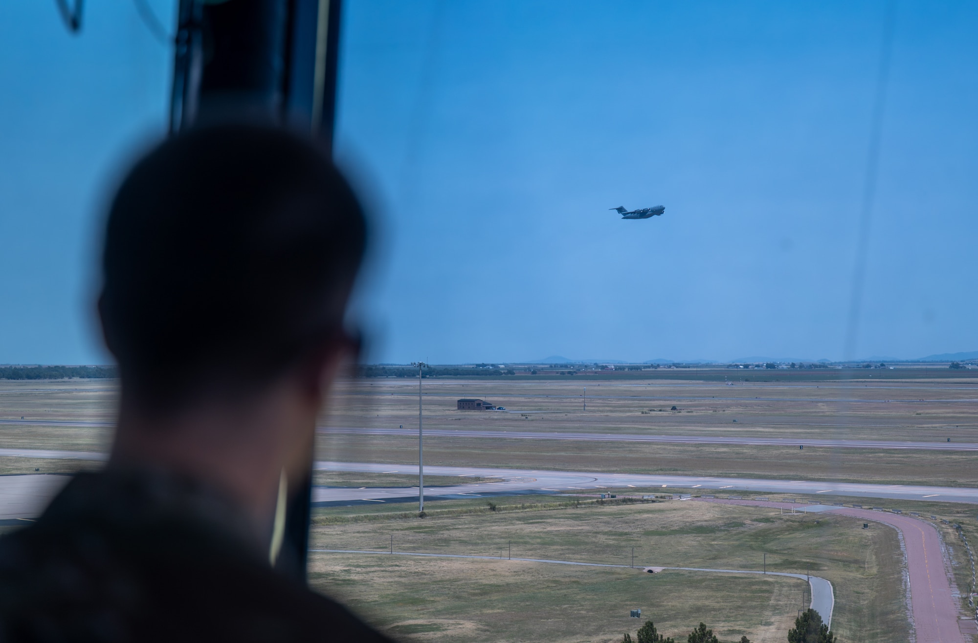 U.S. Air Force Airman 1st Class Luke Hodgen, 97th Operations Support Squadron air traffic control apprentice, monitors an aircraft taking off at Altus Air Force Base, Oklahoma, Aug. 4, 2026. Hodgen sequenced arrivals and departures so aircraft remained safely separated. (U.S. Air Force photo by Airman 1st Class Emma Wright)