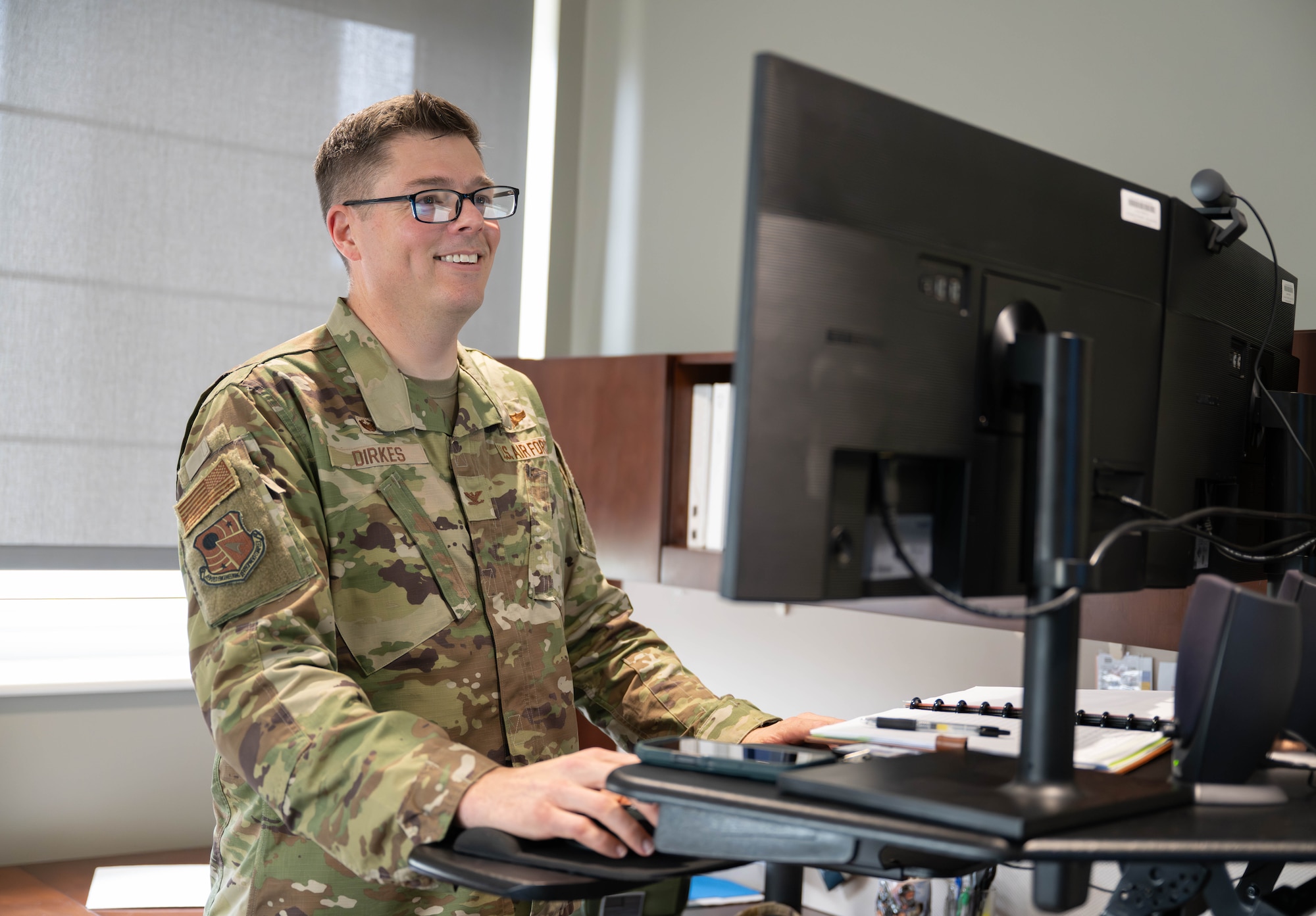 Arnold Engineering Development Complex Commander Col. Wayne Dirkes works Aug. 3, 2026, in his office at Arnold Air Force Base, Tenn. Dirkes assumed command of AEDC on June 27, 2026. Arnold AFB is the headquarters of AEDC. (U.S. Air Force photo by Diamond Brown)