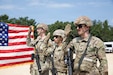 Staff Sgt. Ean Shulta-Oday, Staff Sgt. Brian Molina and Spc. Thomas Warren, soldiers assigned to 418th Quartermaster Battalion, reenlist in a ceremony with Brig. Gen. Paul L. Kuettner, commanding general of 86th Training Division, Aug. 5, during Warrior Exercise (WAREX) 26 at Fort McCoy, Wis. U.S. Army Reserve, Joint, and Multinational leaders and partners joined the 86th Training Division’s premier WAREX Team to deliver rigorous, challenging, and demanding training that replicates multi-domain environments and large-scale combat operations. (U.S. Army photo by Staff Sgt. Karen Sampson)