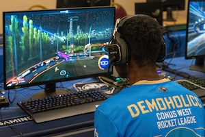 Airman playing a video game