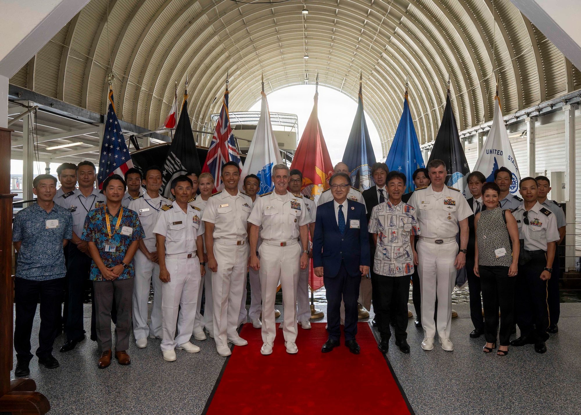U.S. Navy Adm. Steve Koehler, commander, U.S. Pacific Fleet, center left, Katsuaki Kamiji, mayor of the city of Yokosuka, Japan, center right, members of Koehler’s staff, and sailors from the Japan Maritime Self Defence Force pose for a photo at the PACFLT boathouse on Joint Base Pearl Harbor-Hickam, Hawaii, July 29, 2026. Mayor Kamiji is visiting U.S. Navy and U.S. government leaders, demonstrating the key role the city of Yokosuka plays in the U.S.-Japan security partnership. PACFLT delivers combat-ready naval forces to defend the homeland and U.S. interests, provide credible deterrence, and strengthen U.S. alliances and partnerships to ensure a secure and prosperous region. (U.S. Navy photo by Mass Communication Specialist 2nd Class Christopher Sypert)