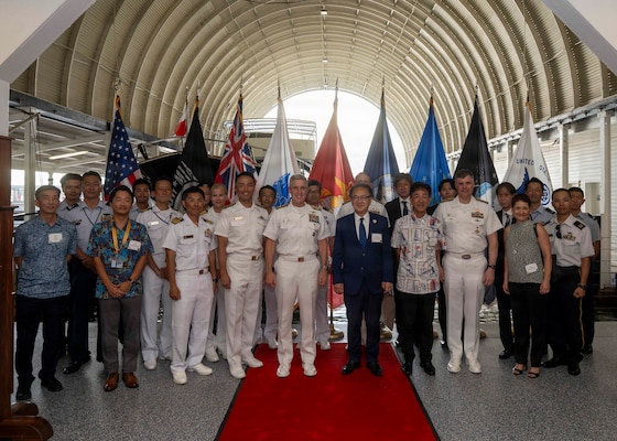 U.S. Navy Adm. Steve Koehler, commander, U.S. Pacific Fleet, center left, Katsuaki Kamiji, mayor of the city of Yokosuka, Japan, center right, members of Koehler’s staff, and sailors from the Japan Maritime Self Defence Force pose for a photo at the PACFLT boathouse on Joint Base Pearl Harbor-Hickam, Hawaii, July 29, 2026.