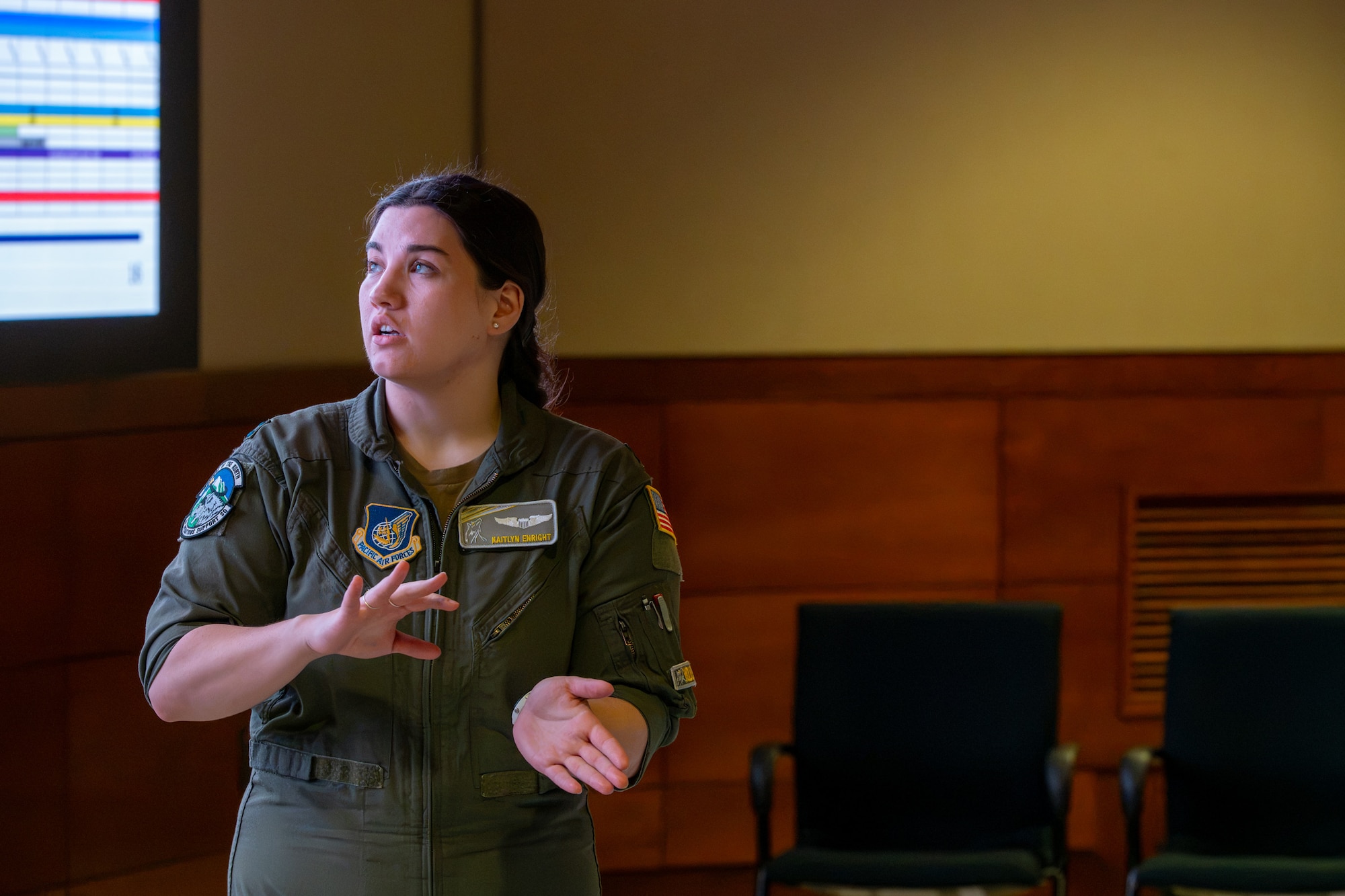 U.S. Air Force Capt. Kaitlyn Enright, Joint Force Demonstration team Air Force lead, 571st mobility support advisory squadron, addresses the JFD team to ensure the team’s performance runs smoothly and safely in preparation for the Arctic Thunder Open House 2026 at Joint Base Elmendorf-Richardson, Alaska, Aug. 5, 2026.