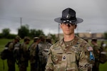 U.S. Space Force Tech. Sgt. Tyler J. Strauser, a military training instructor assigned to Delta 1, Detachment 3, poses for a photo in front of Trainees during a break in training for U.S. Air Force and U.S. Space Force Basic Military Training, Joint Base San Antonio-Lackland, Texas, July 24, 2026. MTIs teach Trainees military discipline and service core values, lead their physical readiness and serve as their mentors in leadership development, to set a foundation for their military careers. (U.S. Air Force Photo by Airman 1st Class Kevin Prashad)