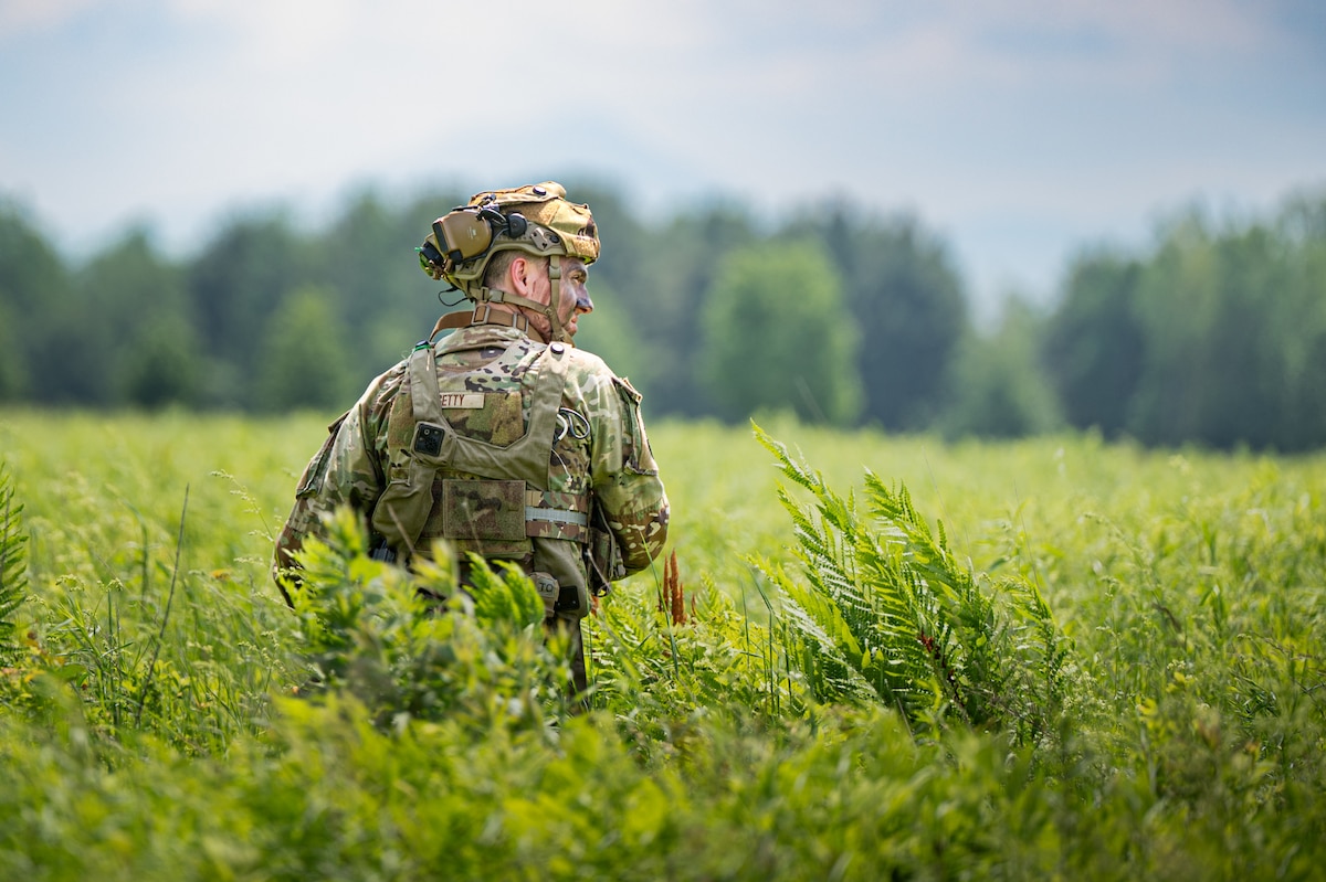 Image of an Airman standing in a field.