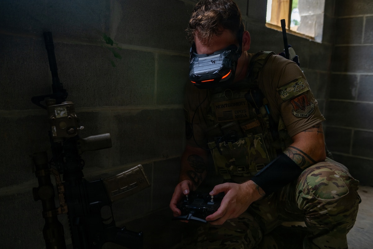 Staff Sgt. Conner Montgomery, 824th Base Defense Squadron force production analyst, displays first-person-view drone goggles at Moody Air Force Base, Ga., July 14, 2026. Using first-person-view drones provides a flexible capability that supports reconnaissance, force protection and operations in environments that may be difficult to access by ground. (U.S. Air Force photo by Airman 1st Class Noah Noonan)