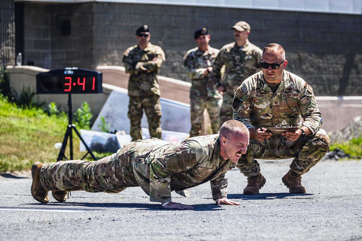 Staff Sgt. Philip Slick performs pushups under pressure during the 101st Air Refueling Wing Security Forces Squadron Best Defender Competition in Bangor, Maine, July 27, 2026. The competition tested security forces Airmen's proficiency in land navigation, marksmanship, tactical fitness, doctrine knowledge and endurance. (U.S. Air Force photo by Senior Master Sgt. Andrew Sinclair)
