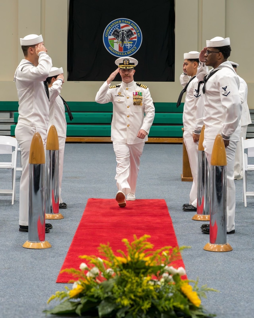 Capt. Frank C. Sanchez relieves Capt. Brian J. Schneider as commodore of Commander, Task Force 67 during a change of command ceremony at Naval Air Station Sigonella, Aug. 7, 2026. (Official U.S. Navy photo)