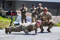 Staff Sgt. Philip Slick performs pushups under pressure during the 101st Air Refueling Wing Security Forces Squadron Best Defender Competition in Bangor, Maine, July 27, 2026. The competition tested security forces Airmen's proficiency in land navigation, marksmanship, tactical fitness, doctrine knowledge and endurance. (U.S. Air Force photo by Senior Master Sgt. Andrew Sinclair)