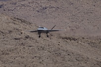 A YFQ-42A Dark Merlin Collaborative Combat Aircraft assigned to the Collaborative Combat Aircraft Experimental Operations Unit approaches Creech Air Force Base, Nev., July 22, 2026. The aircraft is designed to increase tactical flexibility by operating alongside crewed aircraft in contested, dynamic environments. (U.S. Air Force photo by Staff Sgt. Jake Jacobsen)
