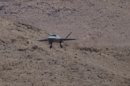 A YFQ-42A Dark Merlin Collaborative Combat Aircraft assigned to the Collaborative Combat Aircraft Experimental Operations Unit approaches Creech Air Force Base, Nev., July 22, 2026. The aircraft is designed to increase tactical flexibility by operating alongside crewed aircraft in contested, dynamic environments. (U.S. Air Force photo by Staff Sgt. Jake Jacobsen)