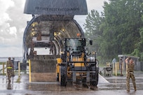 Airmen from the 32nd Aerial Port Squadron load a forklift aboard a static C-5 Galaxy during exercise Steel Anvil at Dobbins Air Reserve Base, Ga., July 11, 2026. Steel Anvil is the Air Force Reserve's first flyaway exercise conducted at the squadron level specifically for air transportation specialists to test the skills and competencies of Port Dawgs in contested conditions and scenarios including inclement weather. (U.S. Air Force photo by Tech. Sgt. Timothy Leddick)