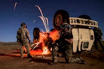 Pararescuemen assigned to the 57th Rescue Squadron, based at Aviano Air Base, Italy, conduct a vehicle extraction of an isolated person during Exercise Savage Jackal at Playas, N.M., July 26, 2026. The training enhanced the squadron's capability to recover isolated personnel from damaged vehicles while preparing rescue forces to respond to complex real-world contingencies. (U.S. Air Force photo by Staff Sgt. Jenna A. Bond)