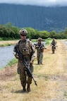 Members of the Colorado National Guard's 140th Security Forces Squadron, or SFS, walk in formation to their next objective during Operation Iron Flag, a hands-on, combat simulation field exercise June 17, 2026, at Bellows Air Force Station, Hawaii.