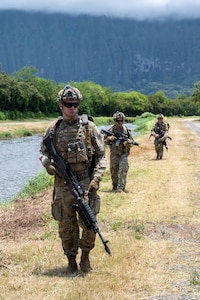 Members of the Colorado National Guard's 140th Security Forces Squadron, or SFS, walk in formation to their next objective during Operation Iron Flag, a hands-on, combat simulation field exercise June 17, 2026, at Bellows Air Force Station, Hawaii.