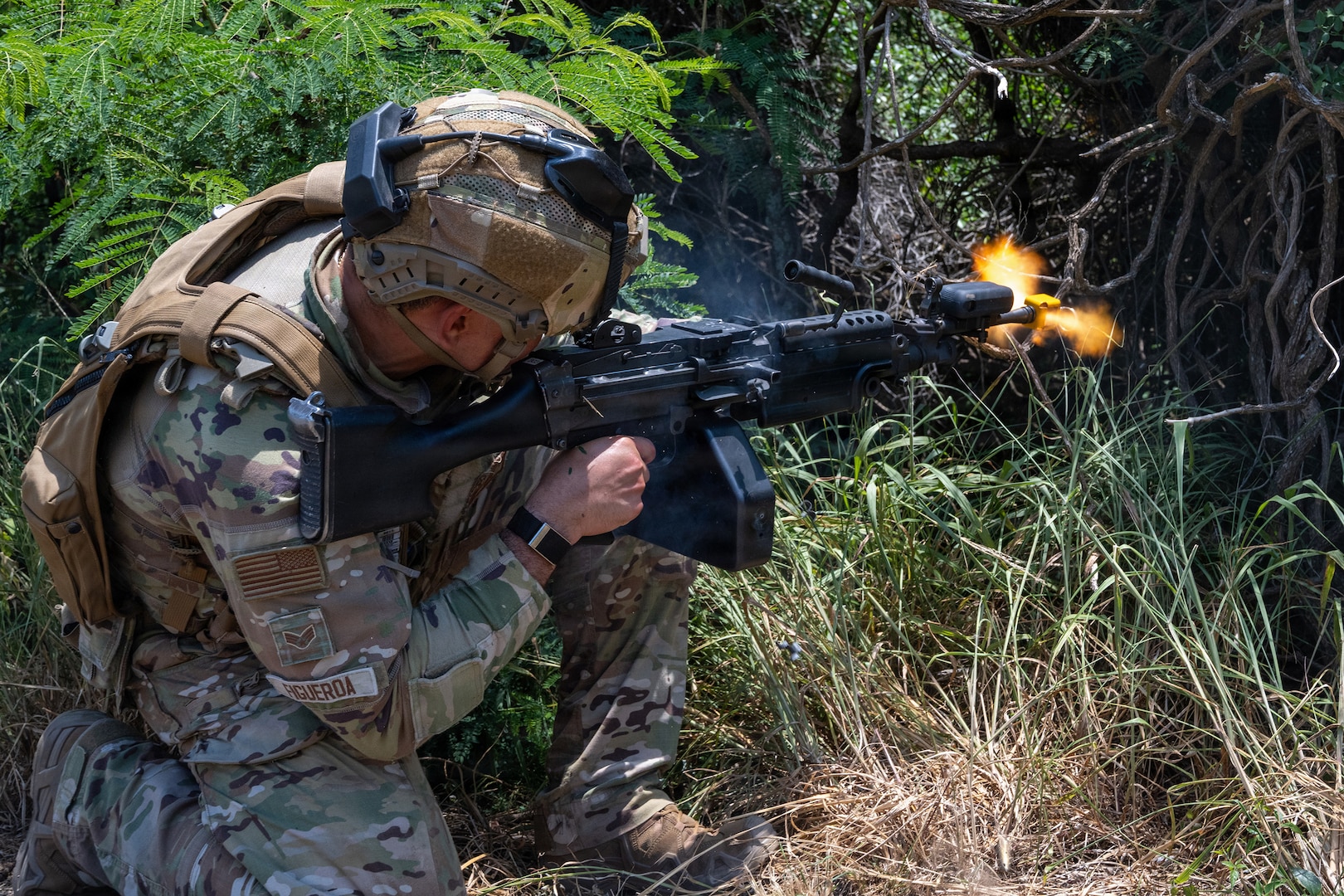 U.S. Air Force Senior Airman Christopher Figueroa, Colorado National Guard 140th Security Forces Squadron, or SFS, security forces specialist, fires at opposition forces during Operation Iron Flag, a hands-on, combat simulation field exercise June 17, 2026, at Bellows Air Force Station, Hawaii.
