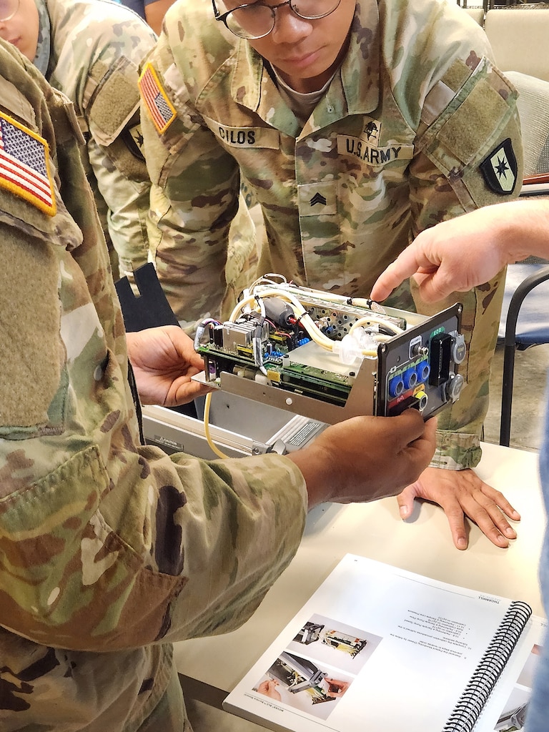 U.S. Army Soldier inspect a medical device during a training event at Fort Bragg, North Carolina.