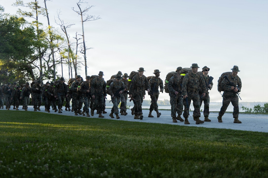 U.S. Marines and Sailors with the 26th Marine Expeditionary Unit conduct a six-mile conditioning hike at Marine Corps Base Camp Lejeune, N.C., May 15, 2026. The hike focused on improving endurance, mental toughness, and unit cohesion to prepare for future MEU composite and upcoming pre-deployment training cycle. (U.S. Marine Corps photo by Cpl. Osmar VasquezHernandez)