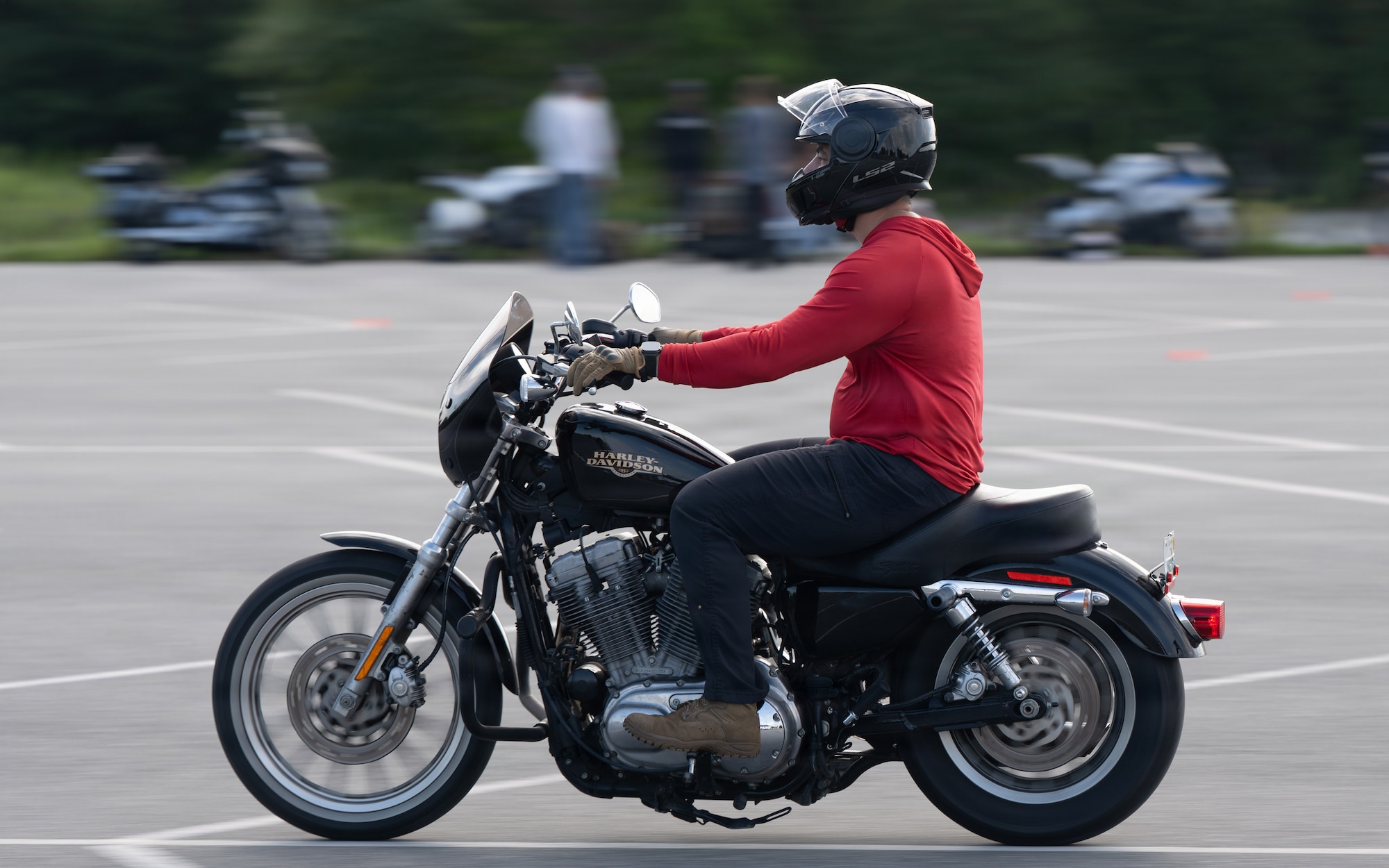 Man rides motorcycle during instructor course