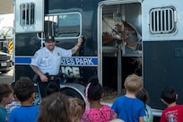 U.S. Park Police mounted patrol officer, introduces his patrol horse, Oden, to children