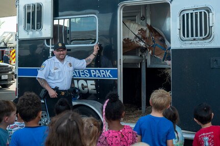 U.S. Park Police mounted patrol officer, introduces his patrol horse, Oden, to children