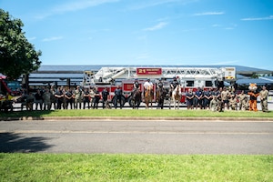 Representatives from local and federal agencies pose for a group photo during National Day Out at Joint Base Anacostia-Bolling, Washington, D.C., Aug. 4, 2026. The 11th Security Forces Squadron hosted the event to strengthen relationships and promote collaboration between public safety partners and community members. (U.S. Air Force photo by Airman 1st Class Arlene Carrara)